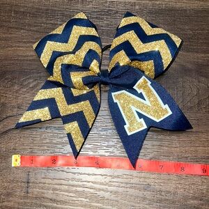 Brand new! Navy & Gold “N” Cheerleading Bow